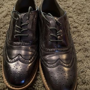 Bronze wing tip shoes